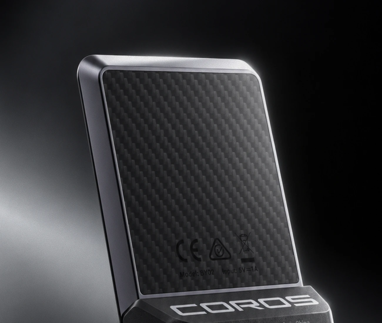 The woven carbon fibre back of the COROS Dura 2 Solar, framed by an aluminium bezel